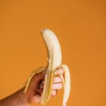 Person Holding Yellow Banana Fruit